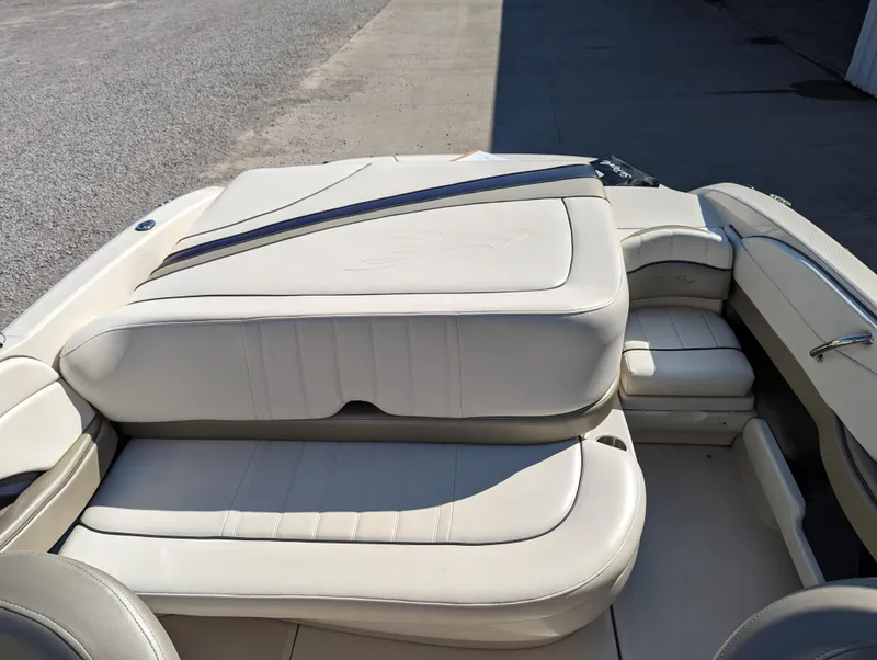 Slide: The Image of 2006 Sea Ray 200 Select boat interior with beige leather seating. - 17