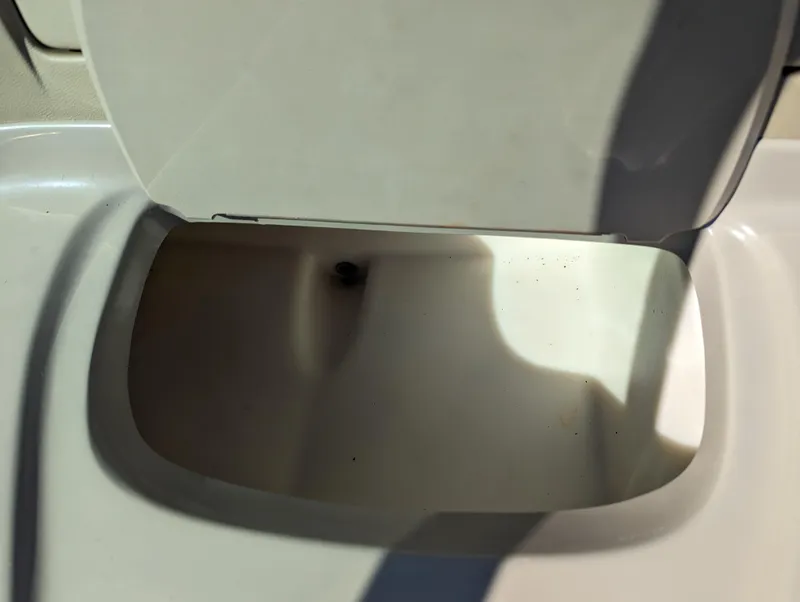 Slide: The Image of Open storage compartment on 2006 Sea Ray 200 Select boat. - 21