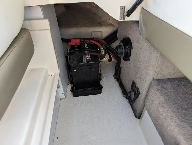 Slide: The Image of 2006 Sea Ray 200 Select boat interior showing battery compartment and wiring. - 24