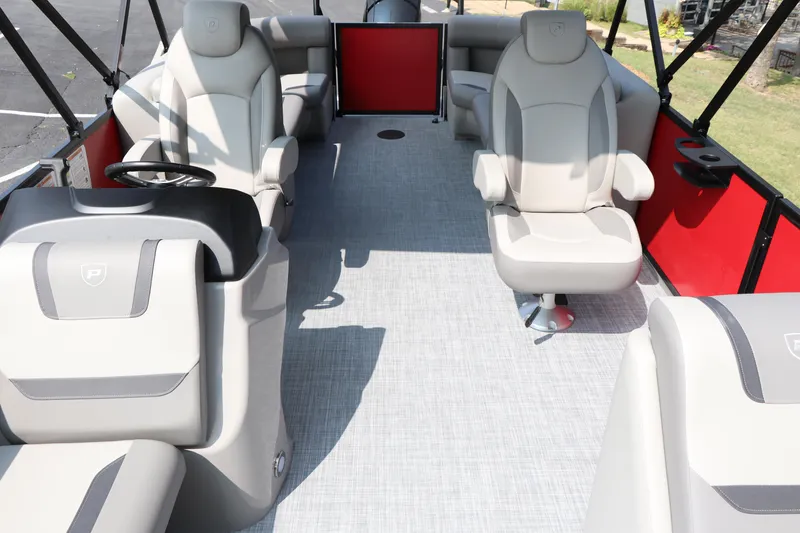 Slide: The Image of 2025 Premier 220 Sunscape boat interior with modern seating and red accents. - 10