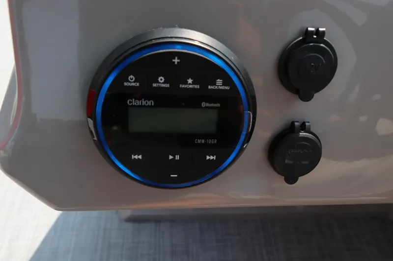 Slide: The Image of Clarion audio system on 2025 Premier 220 Sunscape boat dashboard. - 14