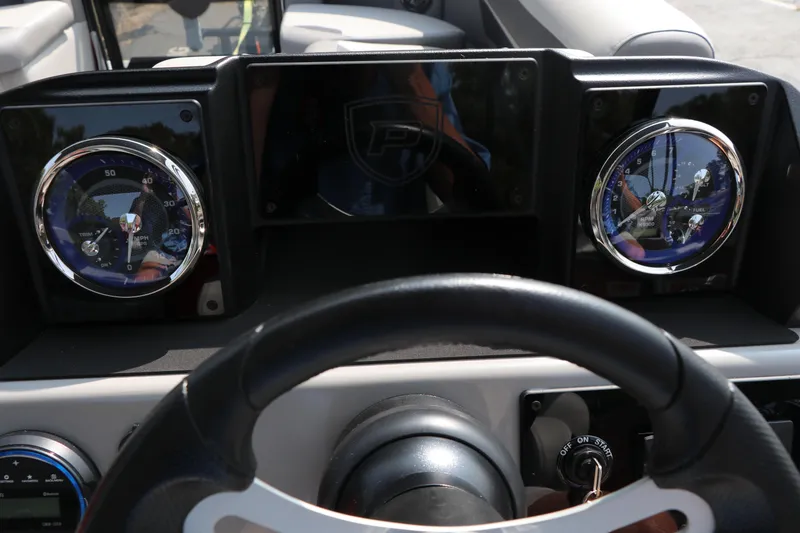 Slide: The Image of Dashboard of 2025 Premier 220 Sunscape boat with steering wheel and gauges. - 15