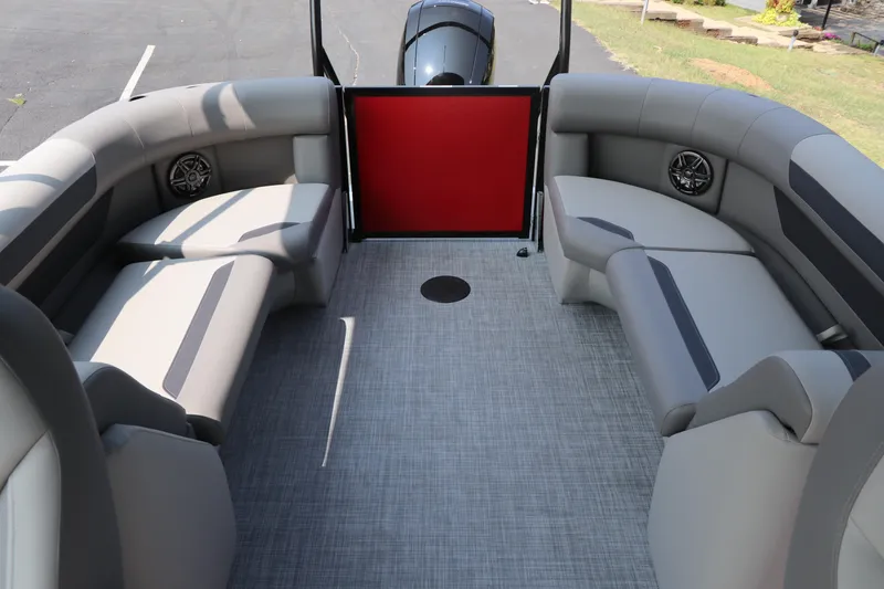 Slide: The Image of 2025 Premier 220 Sunscape boat interior with gray seating and red door. - 19