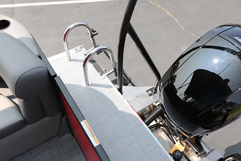 Slide: The Image of Premier 220 Sunscape 2025 boat with motor and seating area, featuring sleek design. - 21