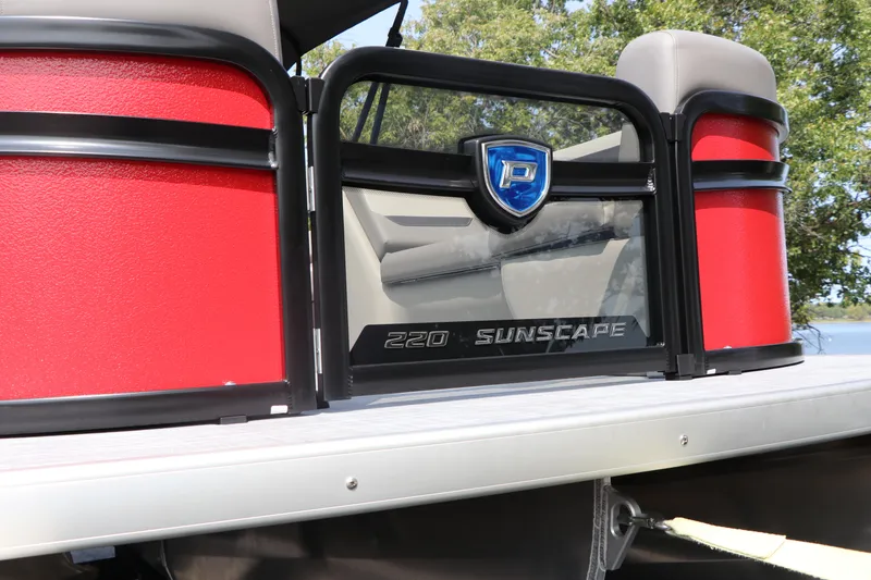 Slide: The Image of 2025 Premier 220 Sunscape pontoon boat with red accents and sleek design. - 3