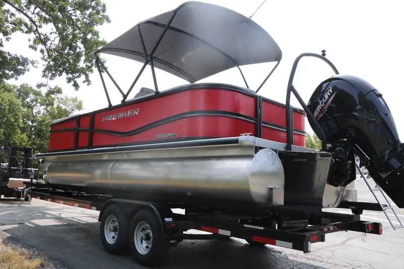 Slide: The Image of 2025 Premier 220 Sunscape pontoon boat on trailer with canopy and outboard motor. - 5