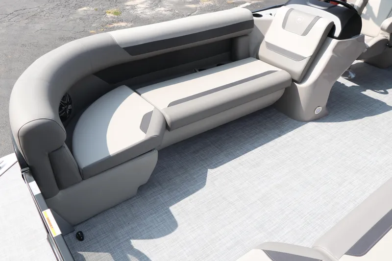 Slide: The Image of 2025 Premier 220 Sunscape boat interior with gray seating and flooring. - 8