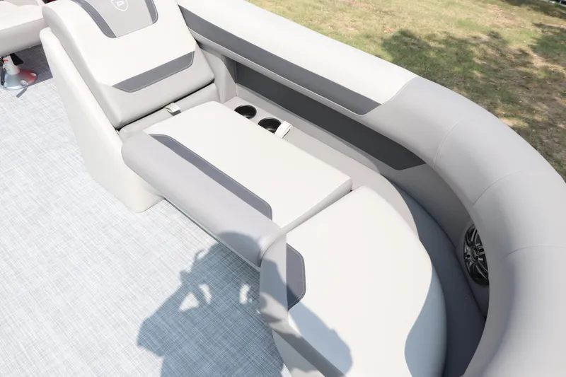 Slide: The Image of Premier 220 Sunscape 2025 boat interior with gray seating and cup holders. - 9