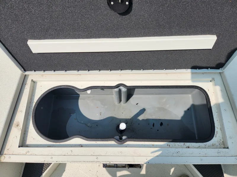 Slide: The Image of Ranger RB200 2022 boat storage compartment, open and empty. - 11
