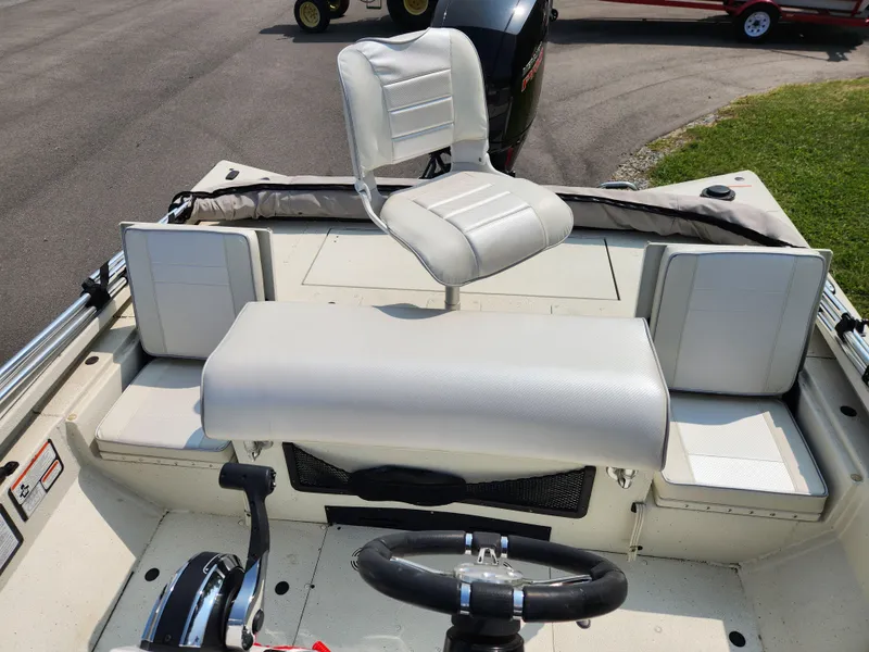 Slide: The Image of 2022 Ranger RB200 boat interior with white seating and steering wheel. - 13