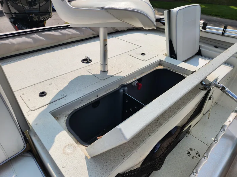 Slide: The Image of 2022 Ranger RB200 boat interior with open storage compartment and seating. - 14
