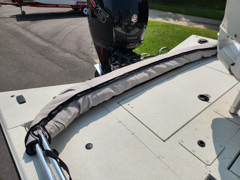 Slide: The Image of 2022 Ranger RB200 boat deck with motor and protective cover. - 17