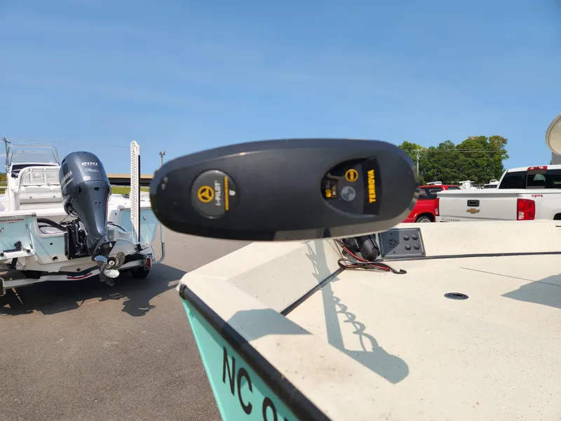 Slide: The Image of 2022 Ranger RB200 boat with Yamaha motor, parked outdoors on a sunny day. - 7