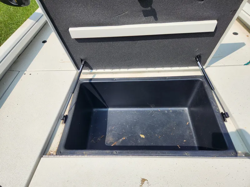 Slide: The Image of Open storage compartment in 2022 Ranger RB200 boat. - 9