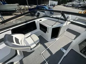 Slide: The Image of 2019 Yamaha Boats SX195 interior with sleek design and modern dashboard. - 13