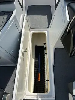 Slide: The Image of 2019 Yamaha SX195 boat storage compartment with open hatch. - 15