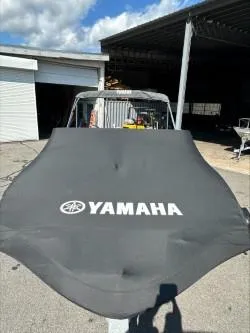 Slide: The Image of 2019 Yamaha SX195 boat with cover in a storage area. - 30
