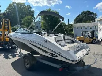 Slide: The Image of 2019 Yamaha Boats SX195 on trailer, parked outdoors under sunny sky. - 5