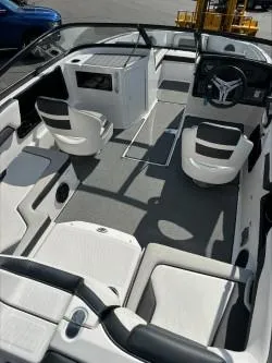 Slide: The Image of 2019 Yamaha Boats SX195 interior with modern seating and sleek dashboard design. - 9