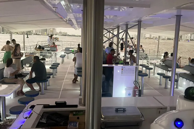 Slide: The Image of People enjoying a cruise on the 2024 Custom PaxCat 80 catamaran. - 11