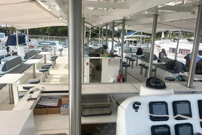 Slide: The Image of Spacious deck of 2024 Custom PaxCat 80 catamaran with seating and navigation equipment. - 12