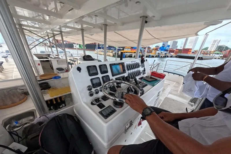 Slide: The Image of Interior view of 2024 Custom PaxCat 80 yacht cockpit with advanced navigation controls. - 13