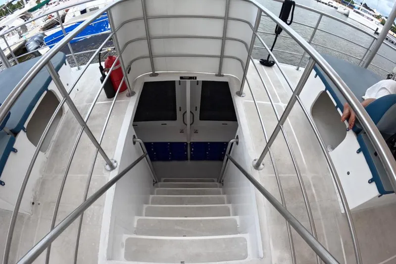 Slide: The Image of Staircase on 2024 Custom PaxCat 80 boat with railing and hatch door. - 18