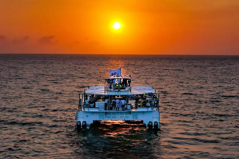 Slide: The Image of Custom PaxCat 80 boat cruising at sunset, 2024 model. - 2