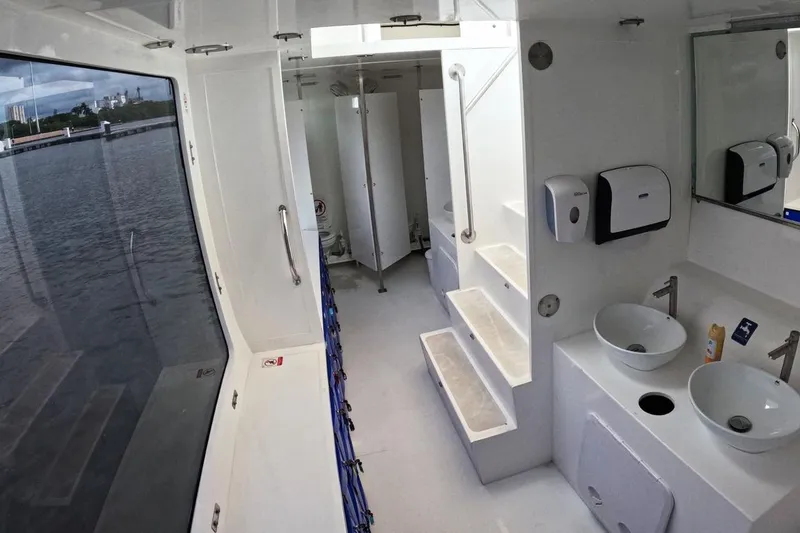 Slide: The Image of Interior of 2024 Custom PaxCat 80 boat with modern bathroom and river view. - 23