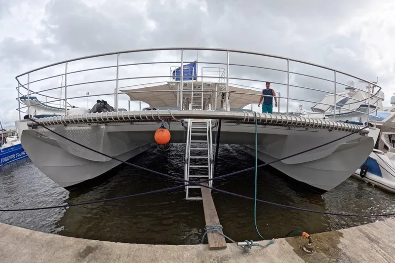 Slide: The Image of Custom PaxCat 80 catamaran docked, 2024 model, with overcast sky. - 5