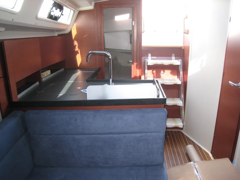 Slide: The Image of Interior of 2025 Hanse 348 yacht with modern kitchen and seating area. - 10