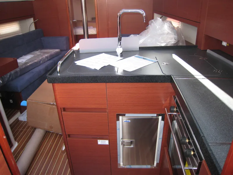 Slide: The Image of Interior of 2025 Hanse 348 yacht with modern kitchen and seating area. - 6