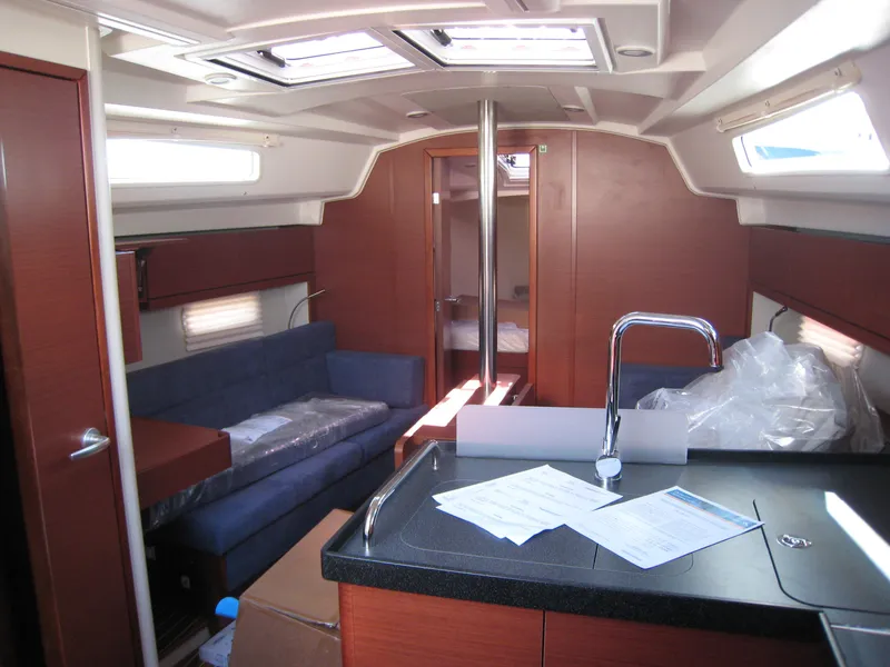 Slide: The Image of Interior of 2025 Hanse 348 yacht with modern kitchen and seating area. - 7