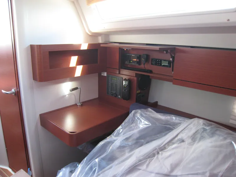 Slide: The Image of Interior of 2025 Hanse 348 yacht with navigation equipment and wooden finish. - 9