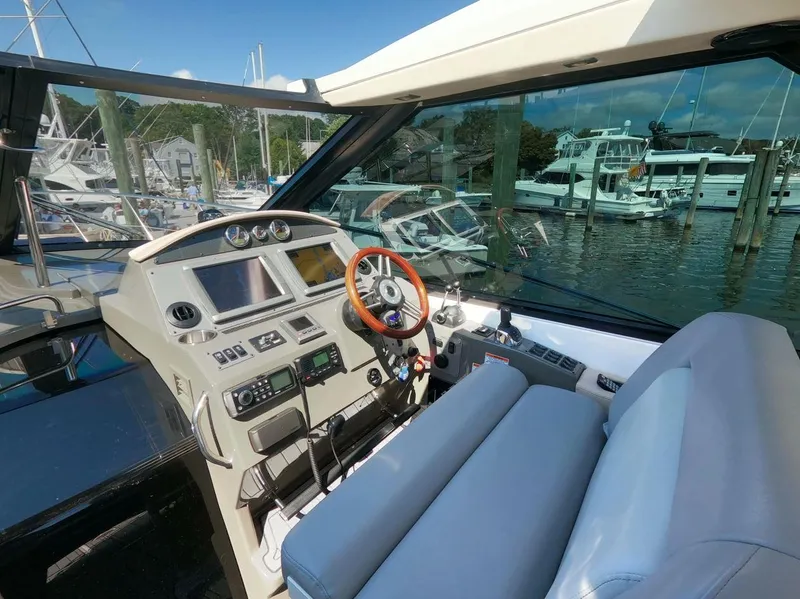 Slide: The Image of Interior cockpit of 2011 Regal 42 Sport Coupe yacht at marina. - 12