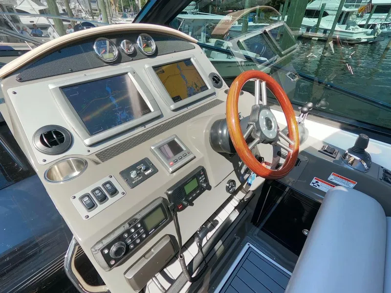 Slide: The Image of 2011 Regal 42 Sport Coupe helm with advanced navigation and control systems. - 13