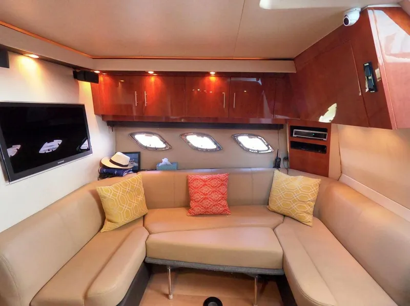 Slide: The Image of Luxurious interior of 2011 Regal 42 Sport Coupe yacht with cozy seating and modern decor. - 30