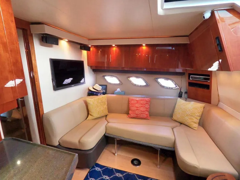 Slide: The Image of Luxurious interior of 2011 Regal 42 Sport Coupe with plush seating and modern amenities. - 31