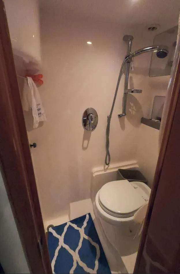 Slide: The Image of Bathroom interior of 2011 Regal 42 Sport Coupe yacht with shower and toilet. - 38