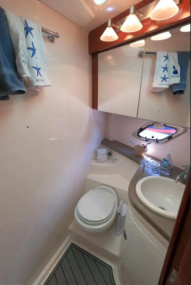 Slide: The Image of Luxurious bathroom in 2011 Regal 42 Sport Coupe yacht with modern fixtures and elegant design. - 40