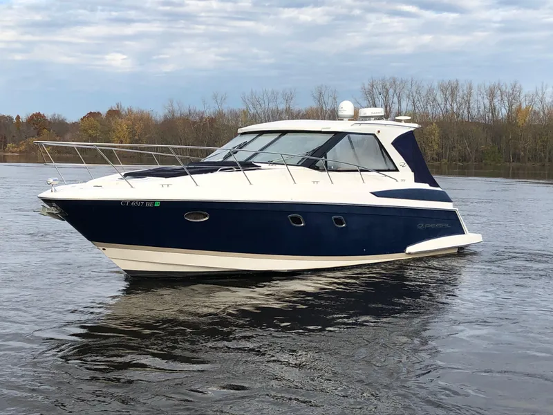 Slide: The Image of 2011 Regal 42 Sport Coupe yacht on calm water, overcast sky. - 45
