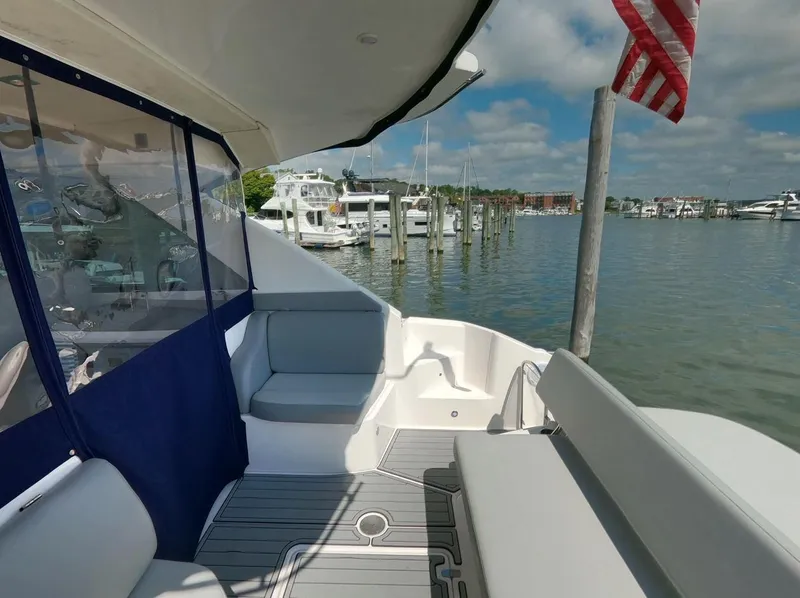 Slide: The Image of 2011 Regal 42 Sport Coupe yacht interior with marina view and American flag. - 9