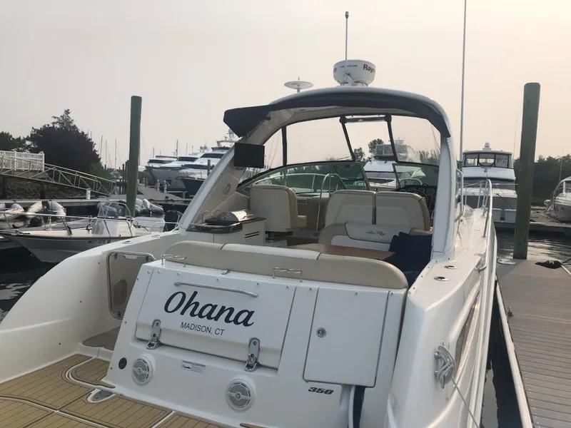 Slide: The Image of 2012 Sea Ray 350 Sundancer yacht docked at marina, rear view. - 3