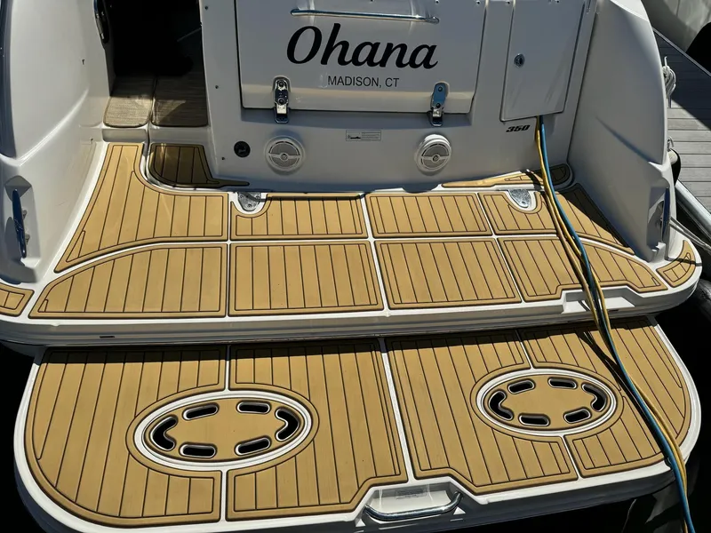 Slide: The Image of Sea Ray 350 Sundancer 2012 boat deck with teak flooring, named "Ohana," Madison, CT. - 4