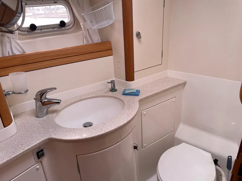 Slide: The Image of Luxurious bathroom in 2003 Oyster 53 yacht with modern fixtures and elegant design. - 38