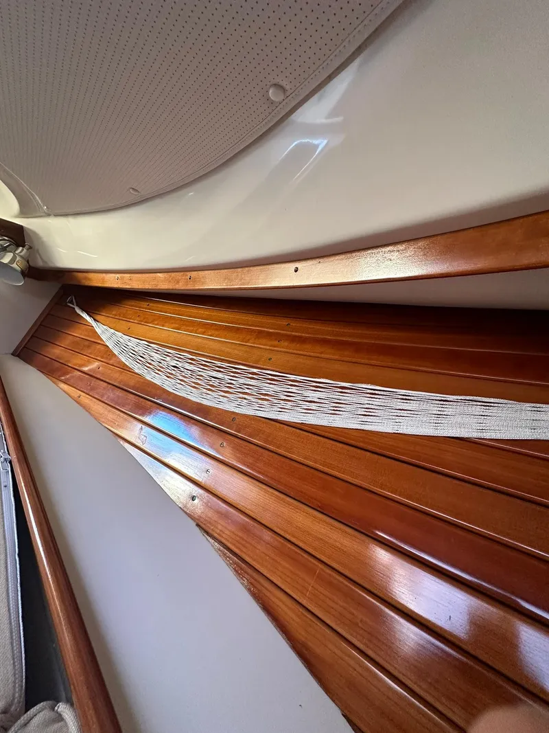 Slide: The Image of Interior view of 1997 Hinckley T29 Express boat with polished wooden paneling. - 31