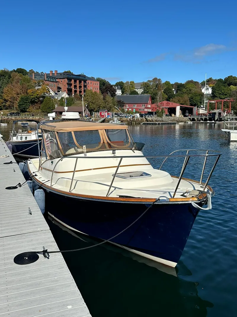 The Image of Hinckley T29 Express 1997 docked at a marina on a sunny day. - 1