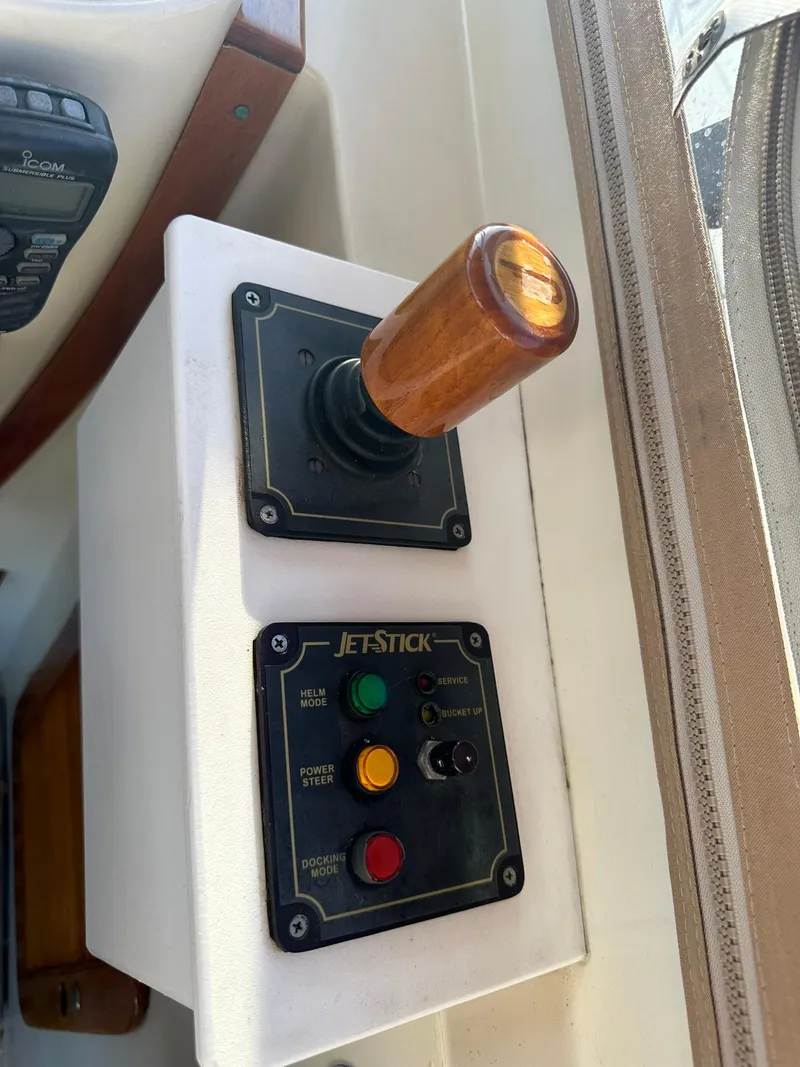 Slide: The Image of Hinckley T29 Express 1997 JetStick control panel with wooden handle and buttons. - 27
