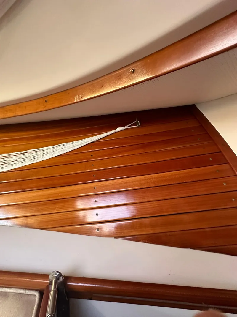 Slide: The Image of Interior wood paneling of a 1997 Hinckley T29 Express boat. - 30