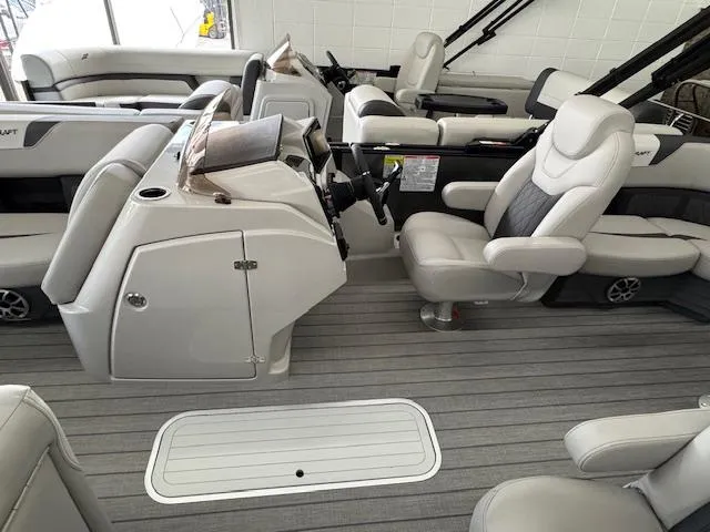 Slide: The Image of 2025 Starcraft SLS 1 boat interior with modern seating and steering console. - 10
